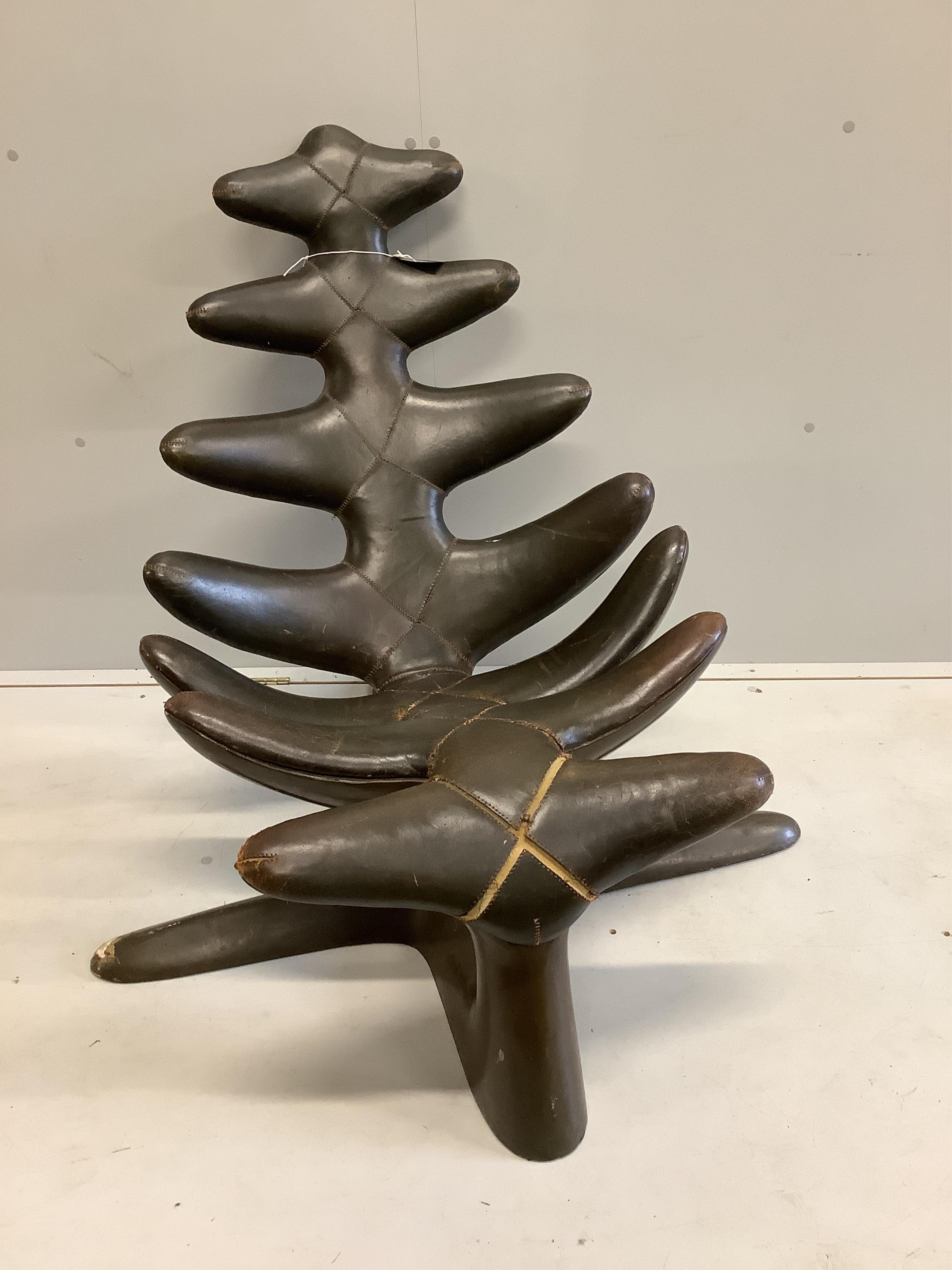 A mid century modernist reclining leather chair, width 100cm, depth 100cm, height 94cm